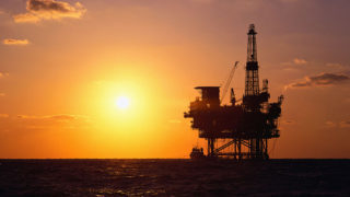 Picture of oil rig at sunset