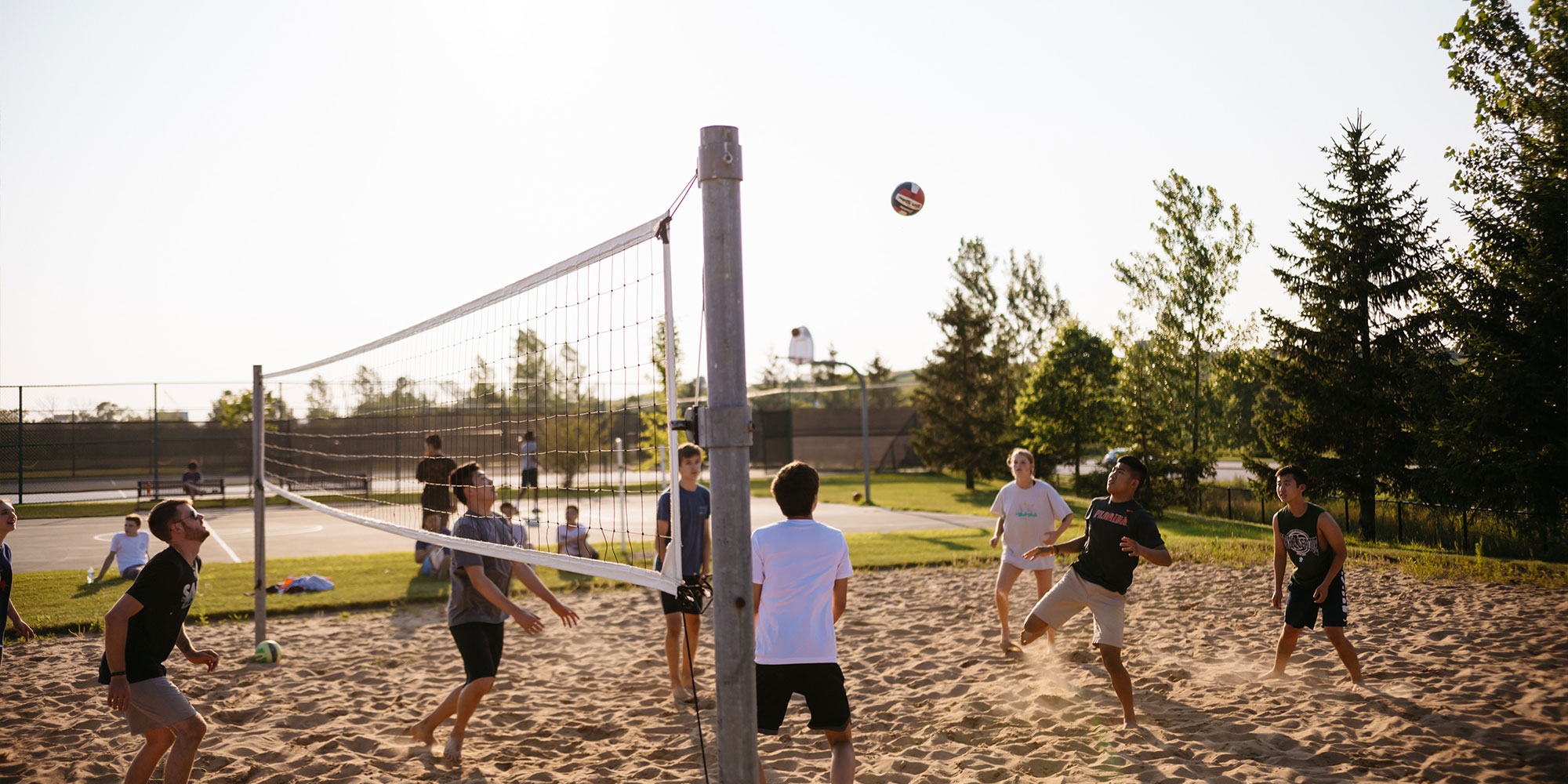 Students playing game of volleyball